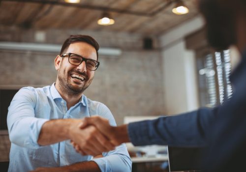 Close up of handshake in the office